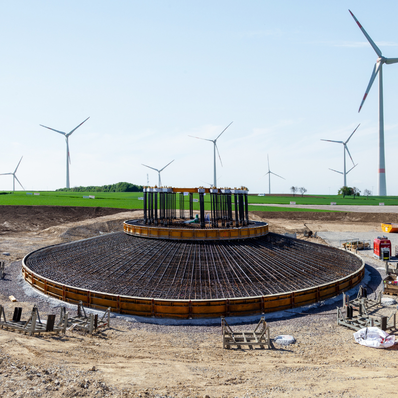 Construction site. Foundations of wind turbines with concrete and steel. building wind turbines. metalwork in the foundation of a wind turbine base.