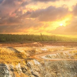 sunset view over an open pit mine - Header banner